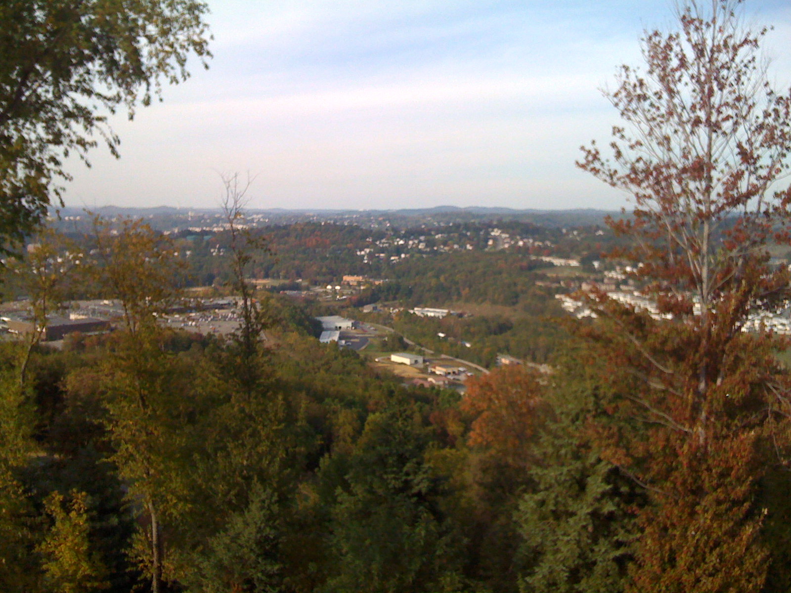 the view from atop a hill, overlooking the city