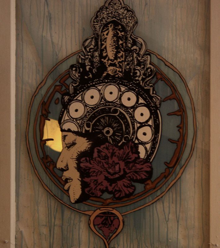 a clock with intricate carvings and a unique design