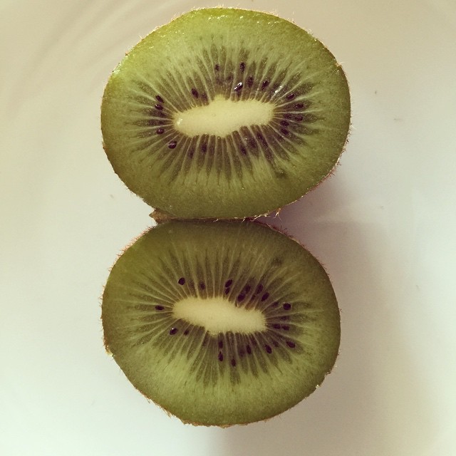 a couple of kiwi pieces are arranged on top of each other