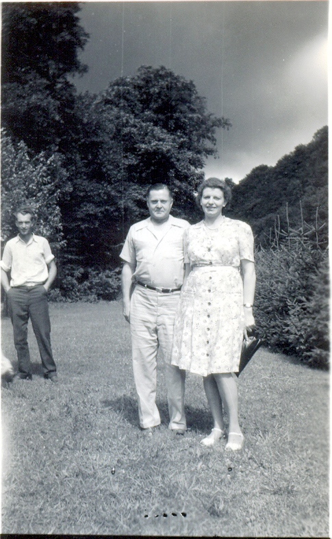 a black and white po of a man and woman posing for the camera