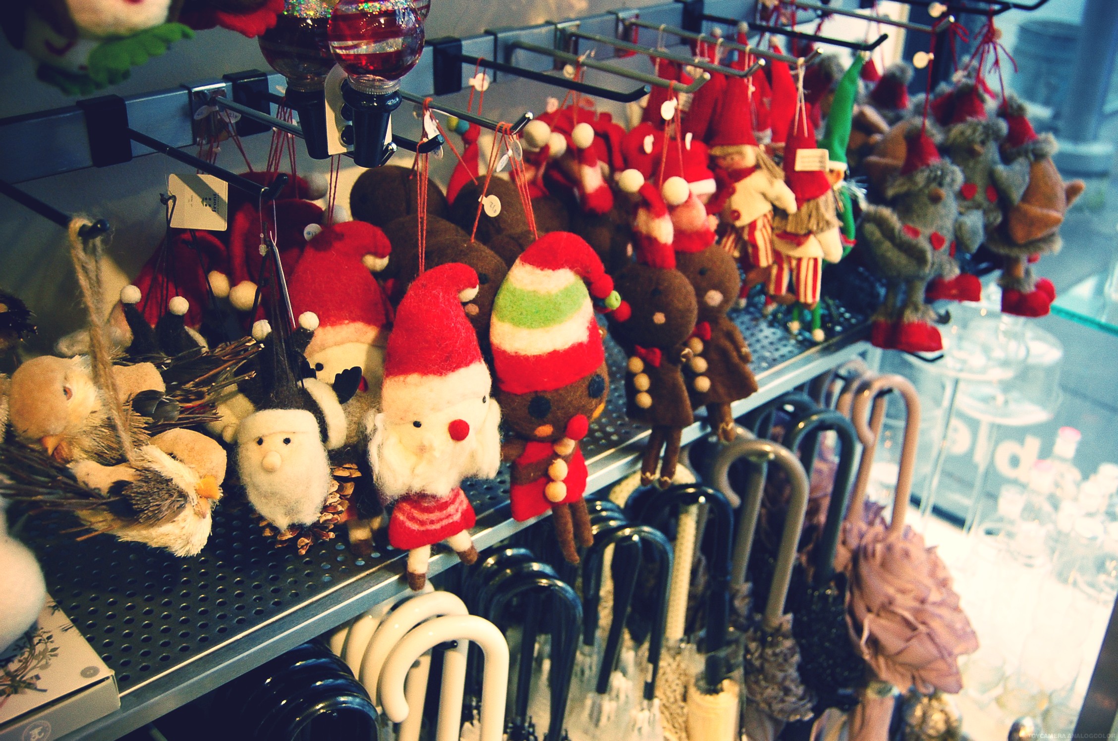 many stuffed animals are displayed on the rack