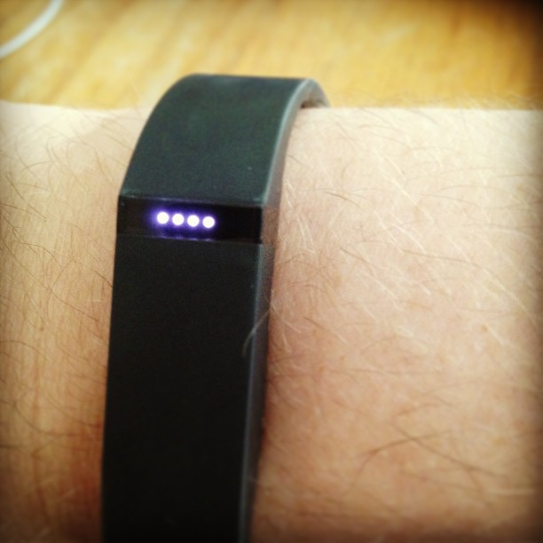 a wristband with a smart watch on top