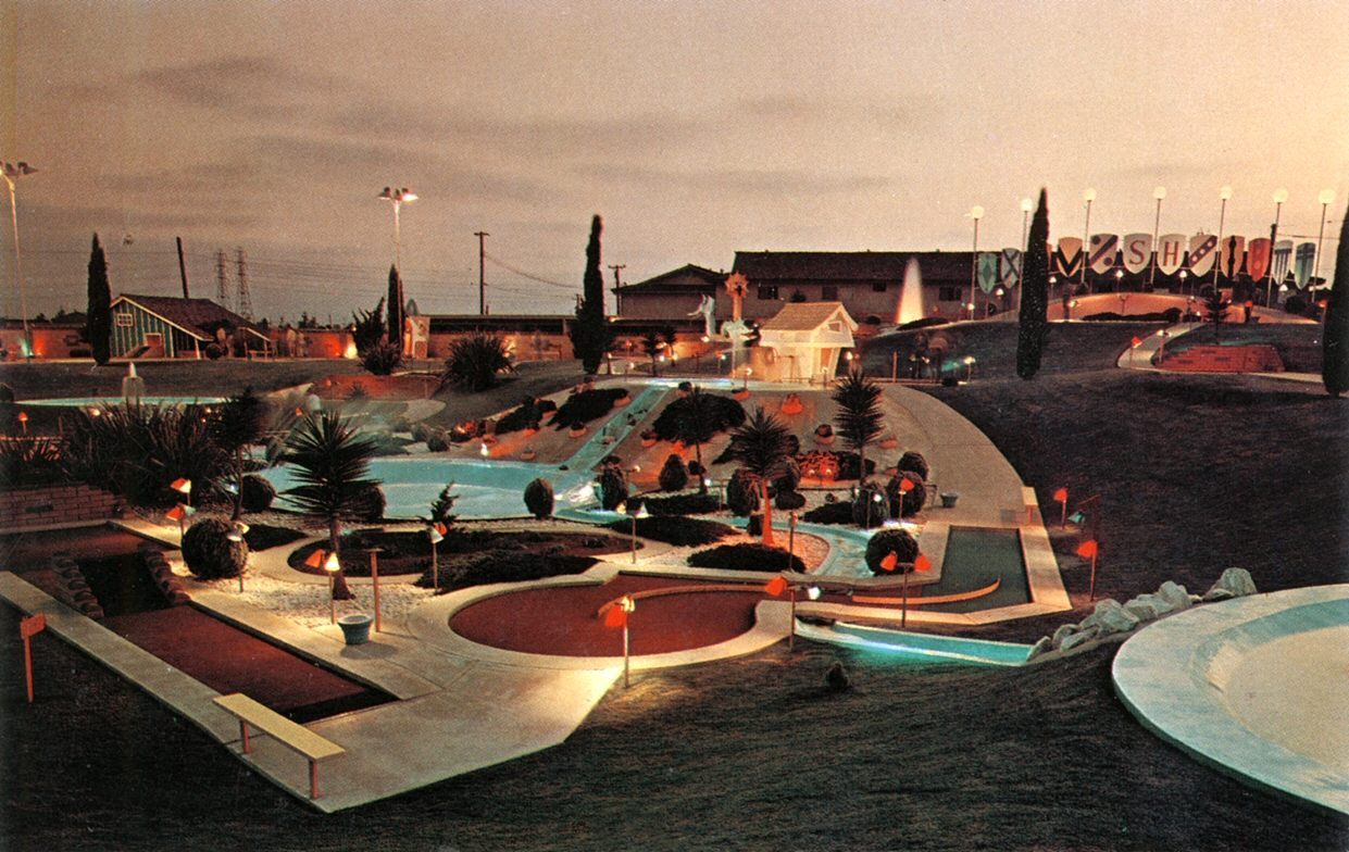 a colorful and empty parking lot near a water park