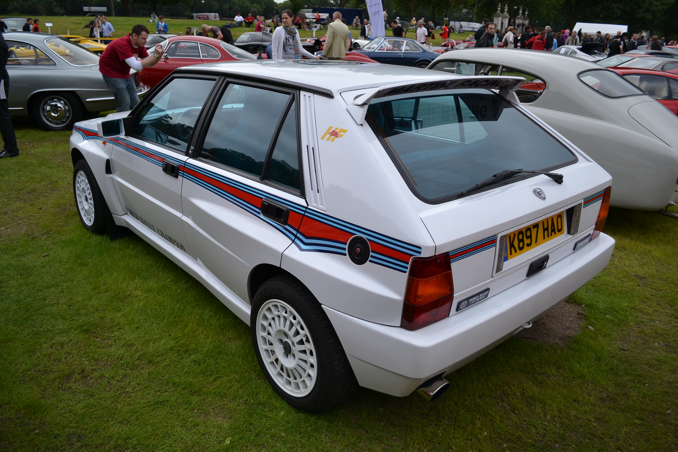 an automobile show featuring several parked cars