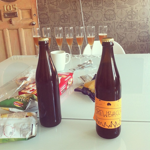 a few drinks are sitting on a counter with other beverages