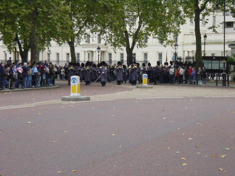 a crowd of people standing in front of a building