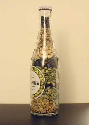 a large glass bottle filled with green food