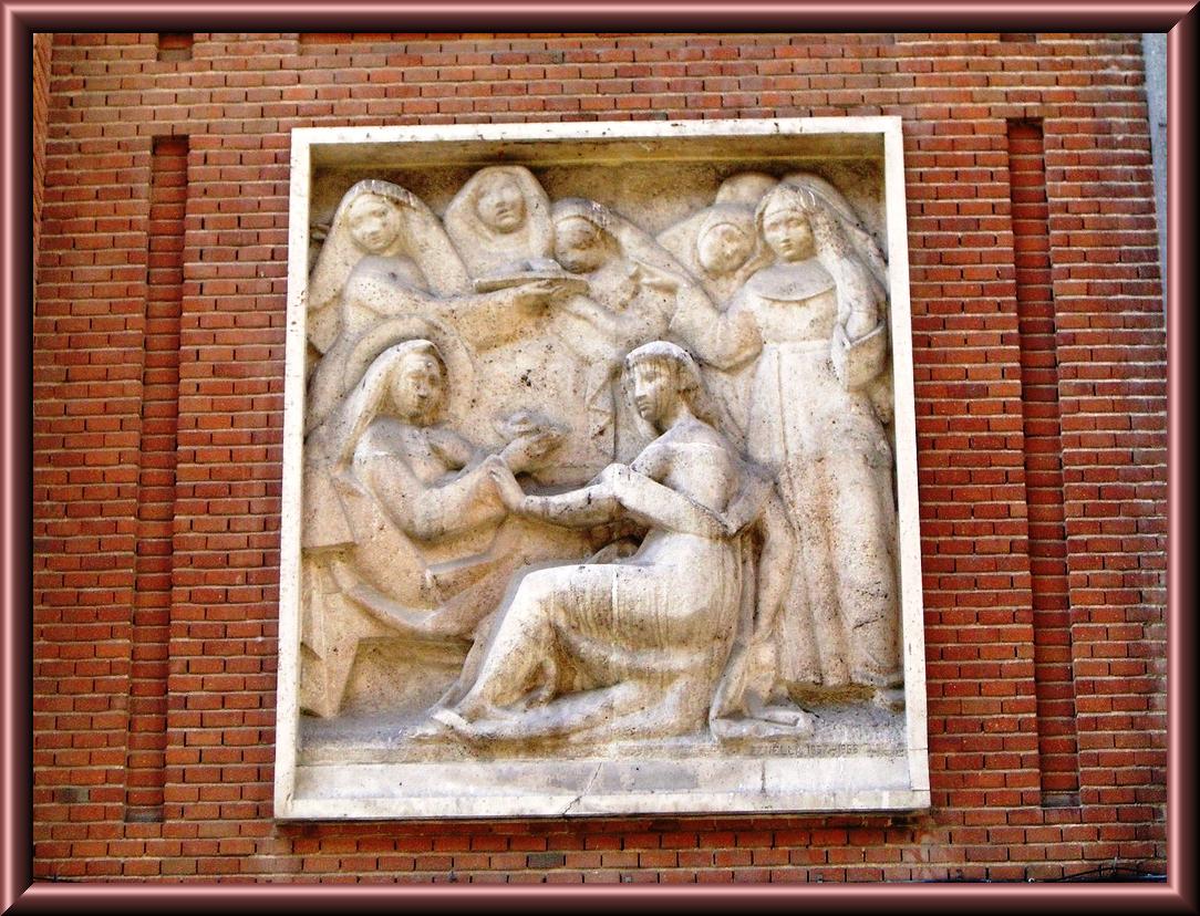 a bas relief is shown with a brick wall in the background