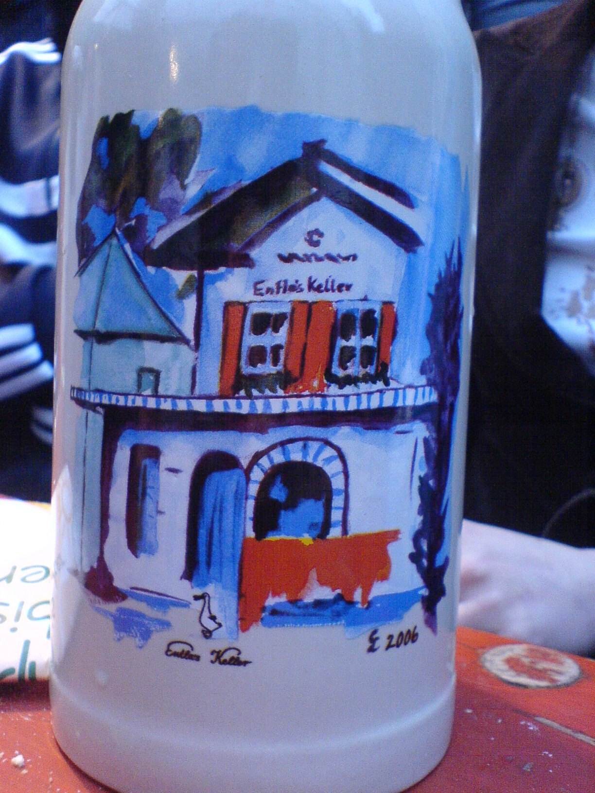 a colorfully decorated bottle is on the table