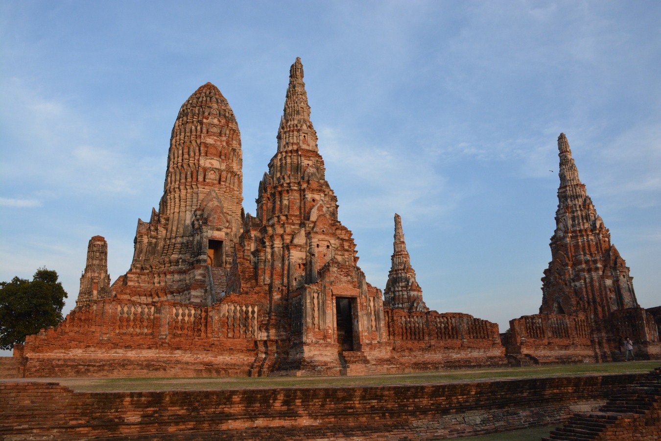 a building with spires made of orange bricks