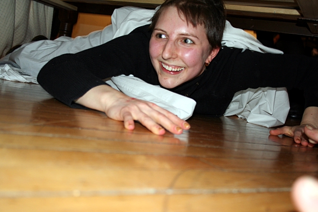 a girl lying on her stomach on the floor