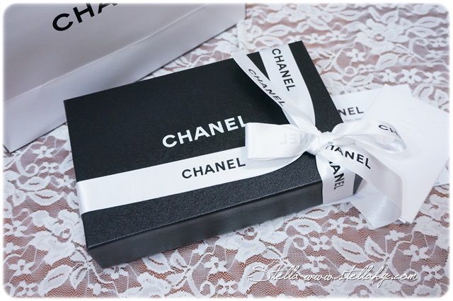 two boxes sit on a lace covered cloth