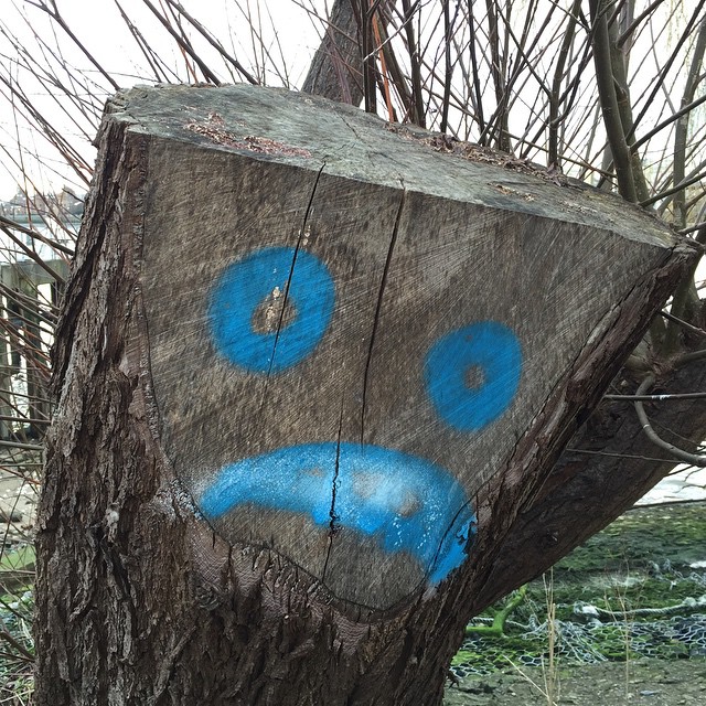 a wooden block with a face painted on it