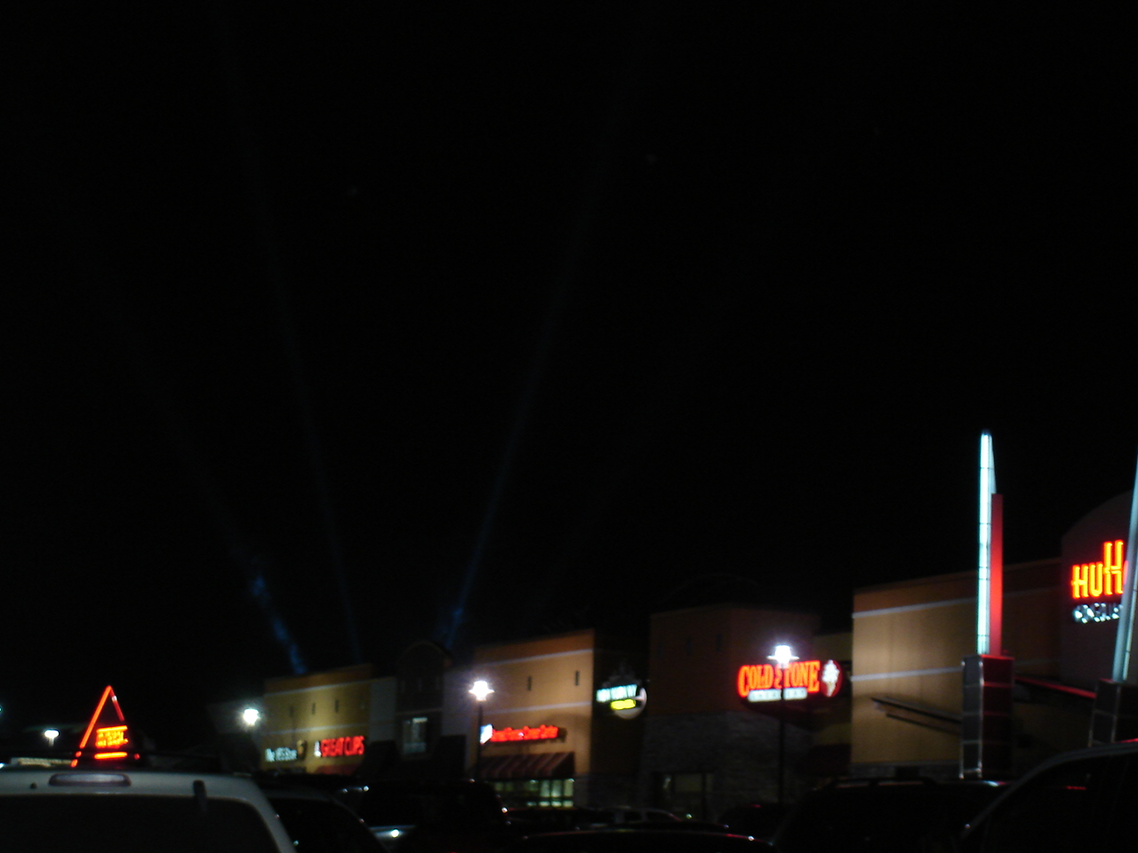 the exterior of a retail center at night