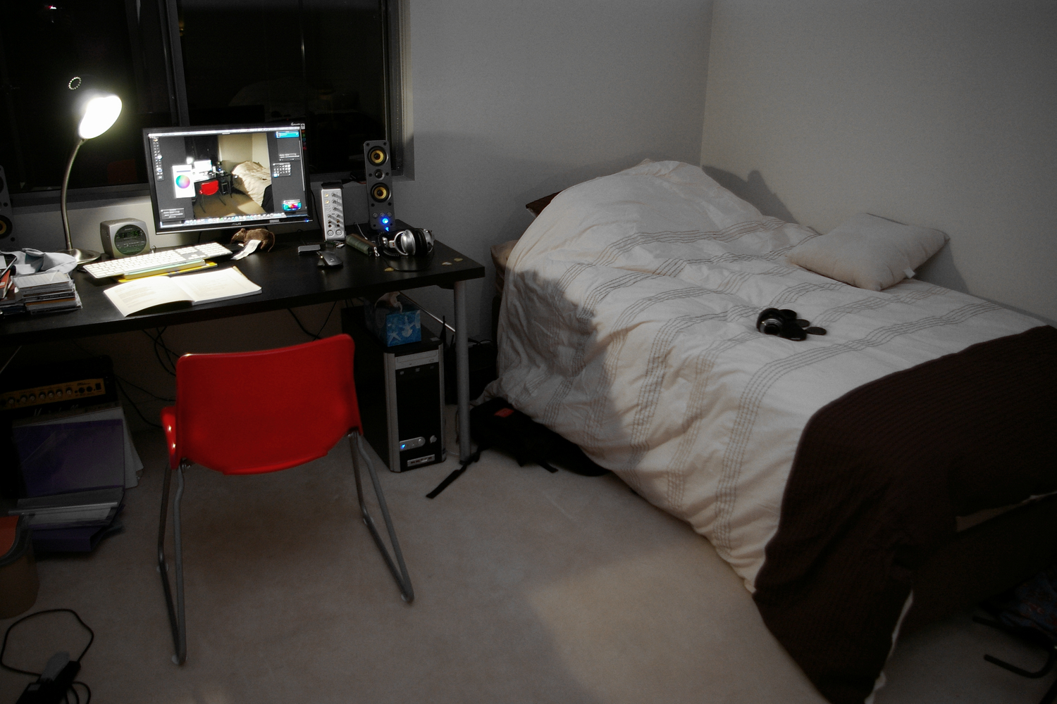 bedroom with desk with a laptop and keyboard on the desk