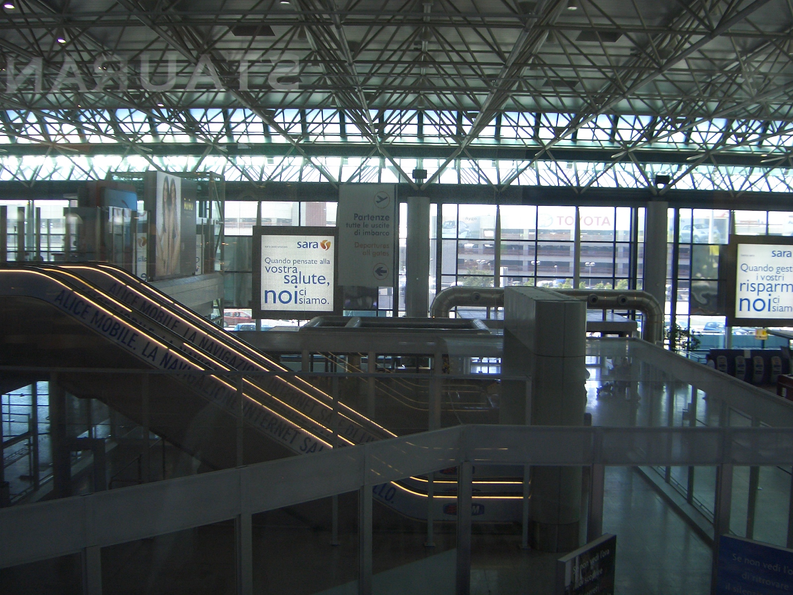 the airport has an escalator and stairs in it