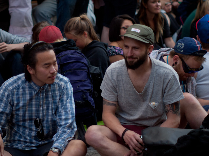 men sitting together in front of an audience