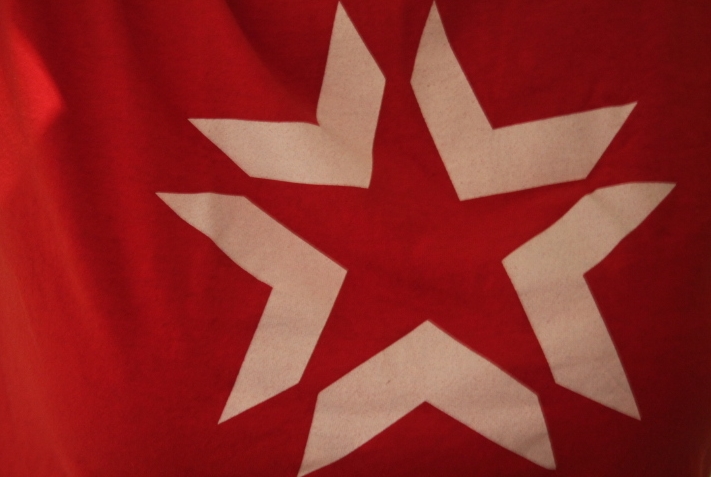 a picture of a red shirt with white stars