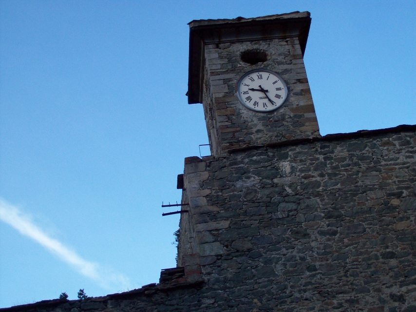 an old brick tower with a clock