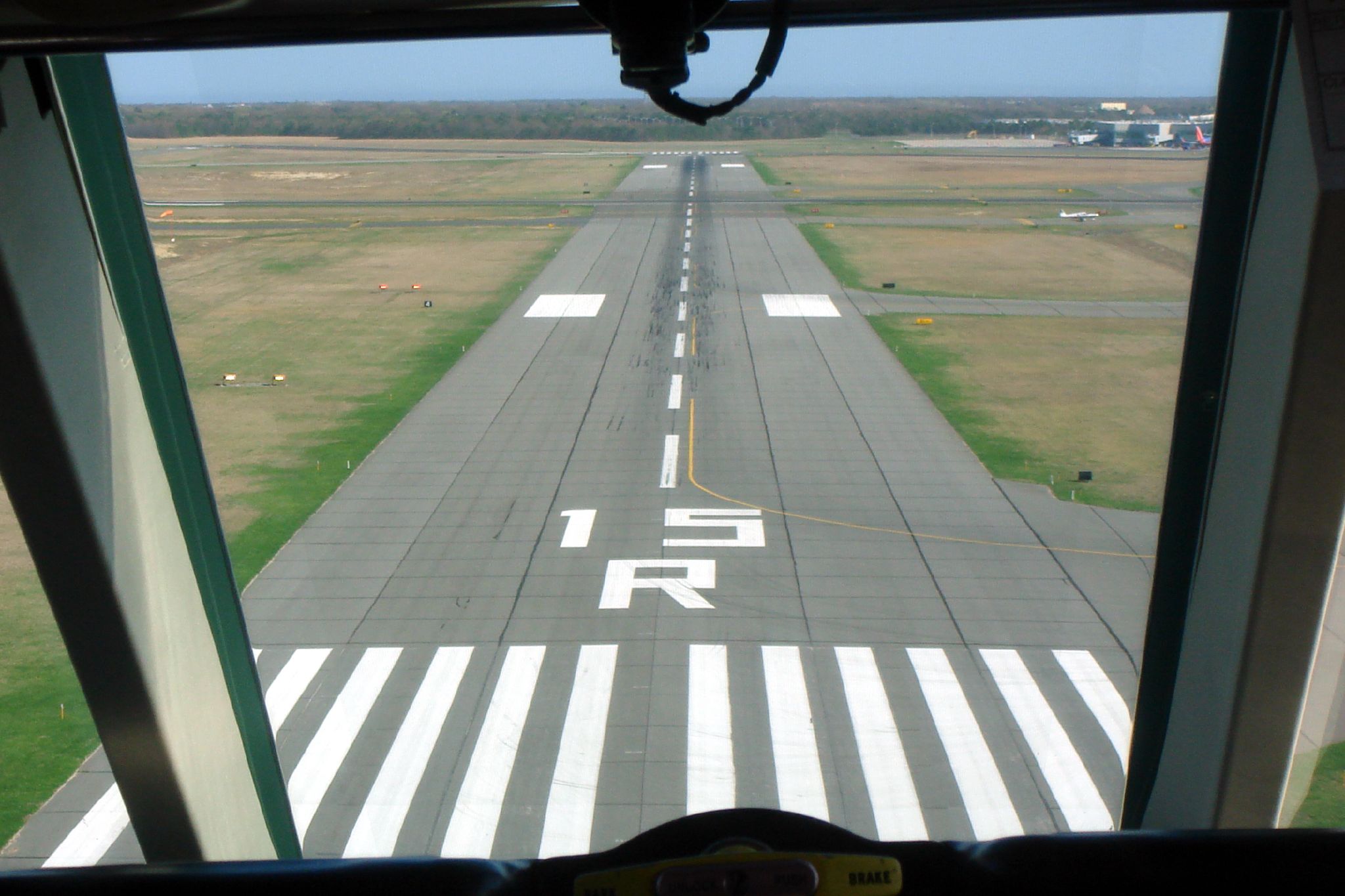 a view from an airplane, looking down at the runway
