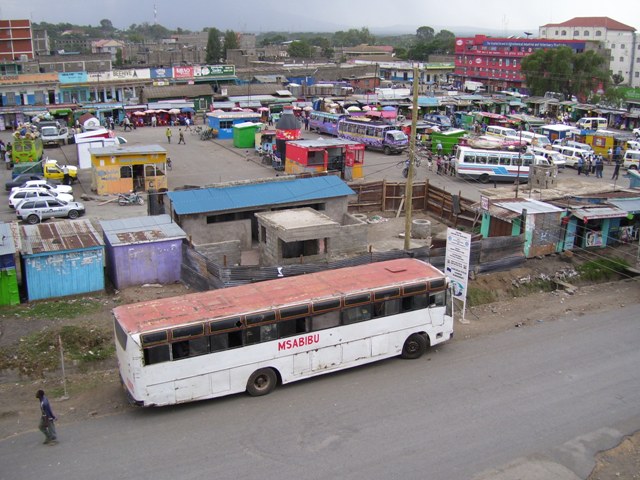 an old bus in a rundown slum area