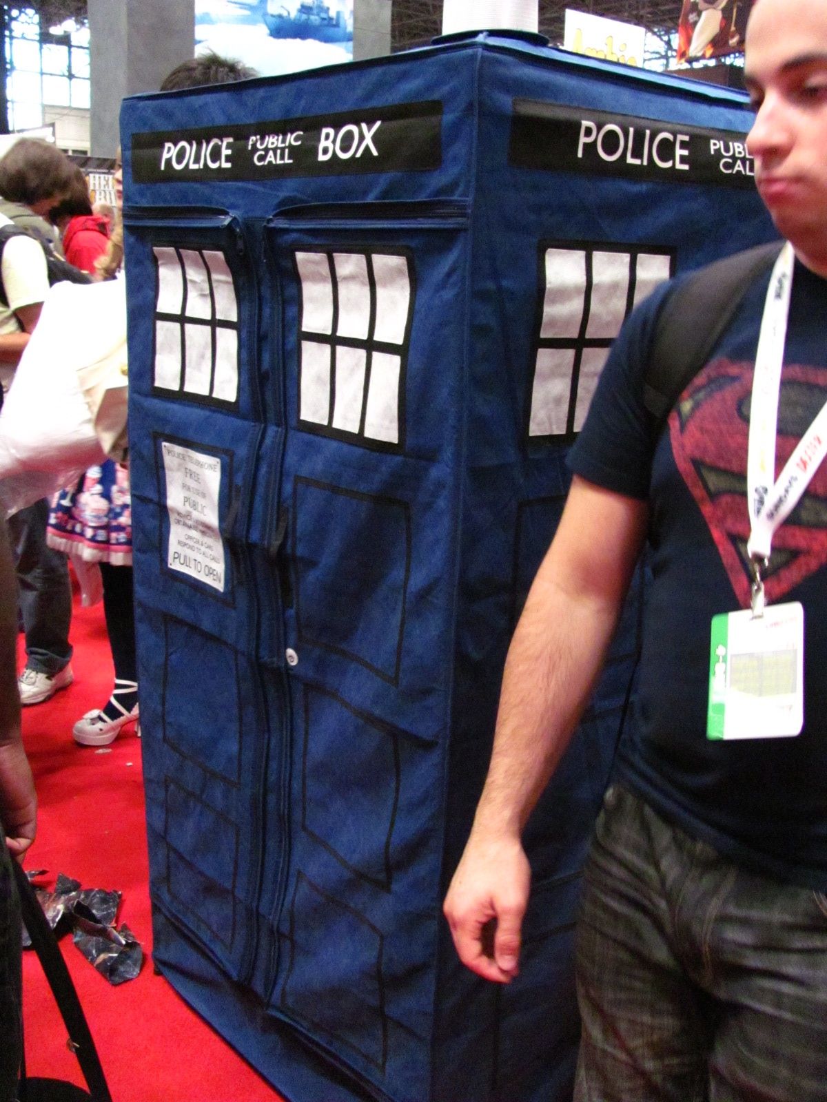 a man stands next to a doctor who is dressed in his costume
