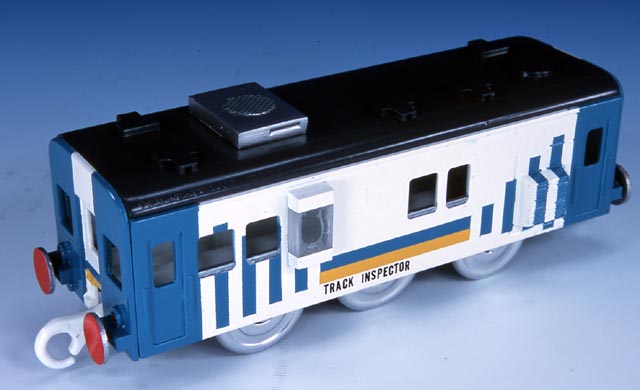 a toy train car sits on the table