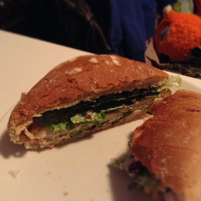 a close up view of a half eaten sandwich