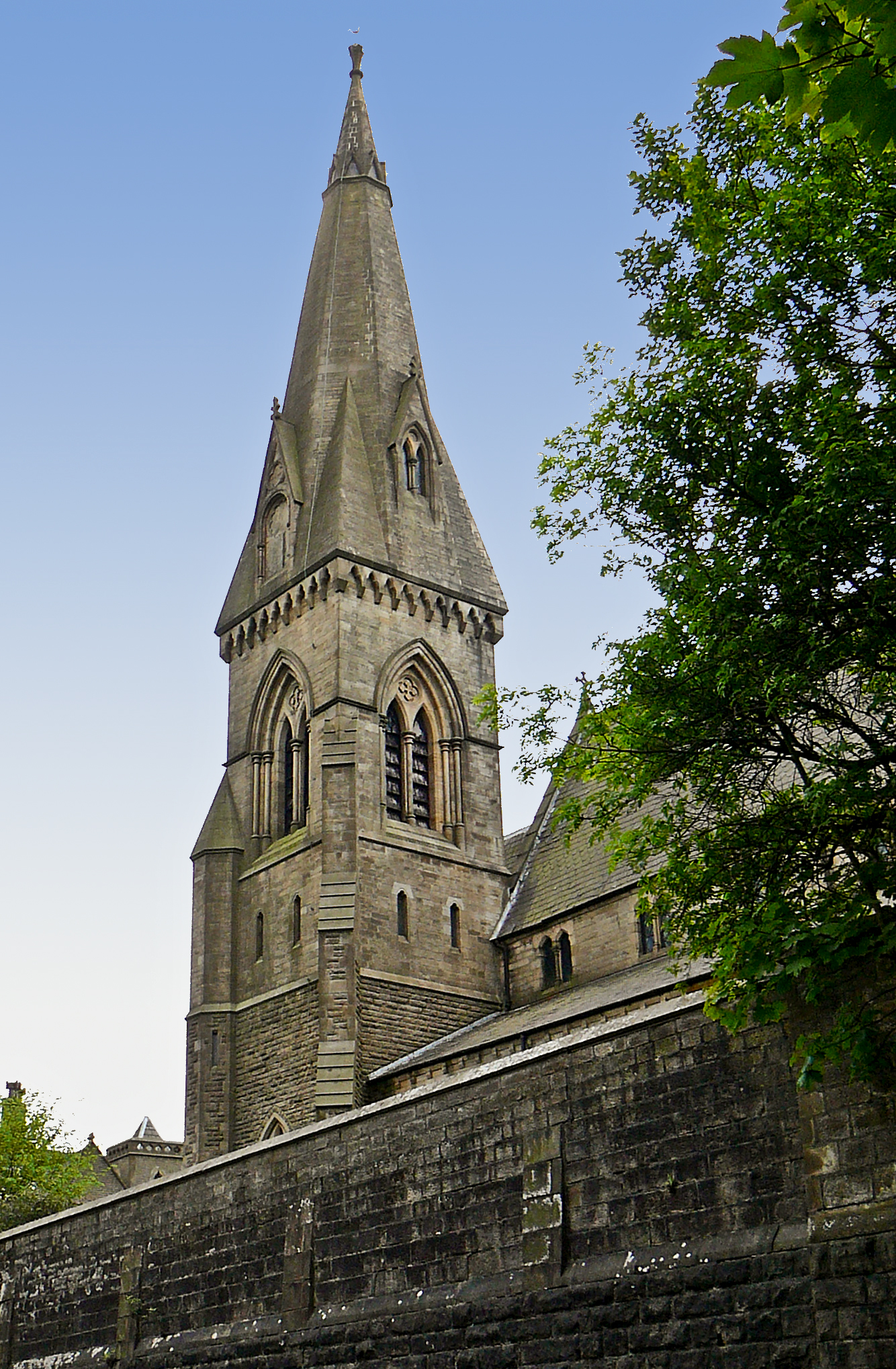 there is a very tall stone building with a clock tower