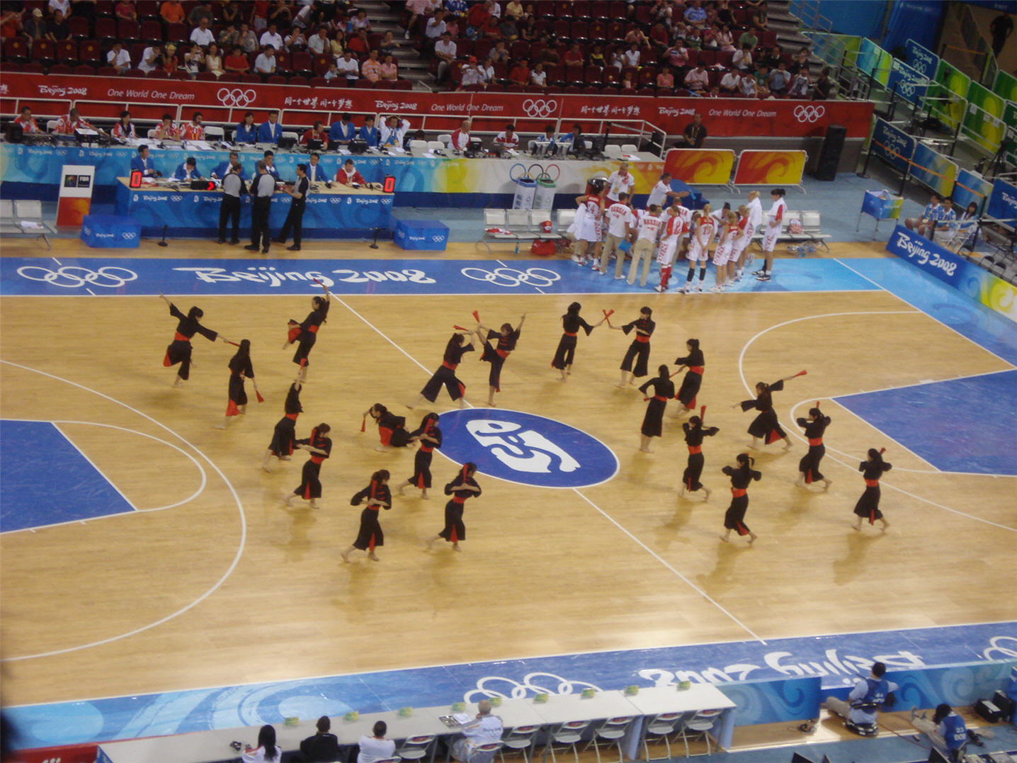 a group of people perform in a court