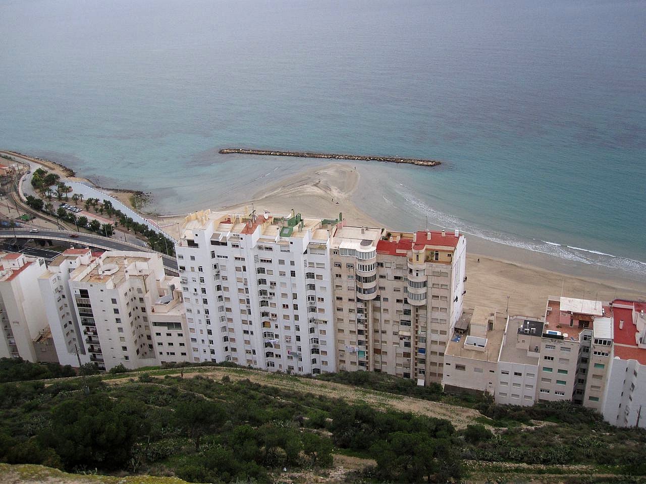 a beach and a city is shown, seen from above