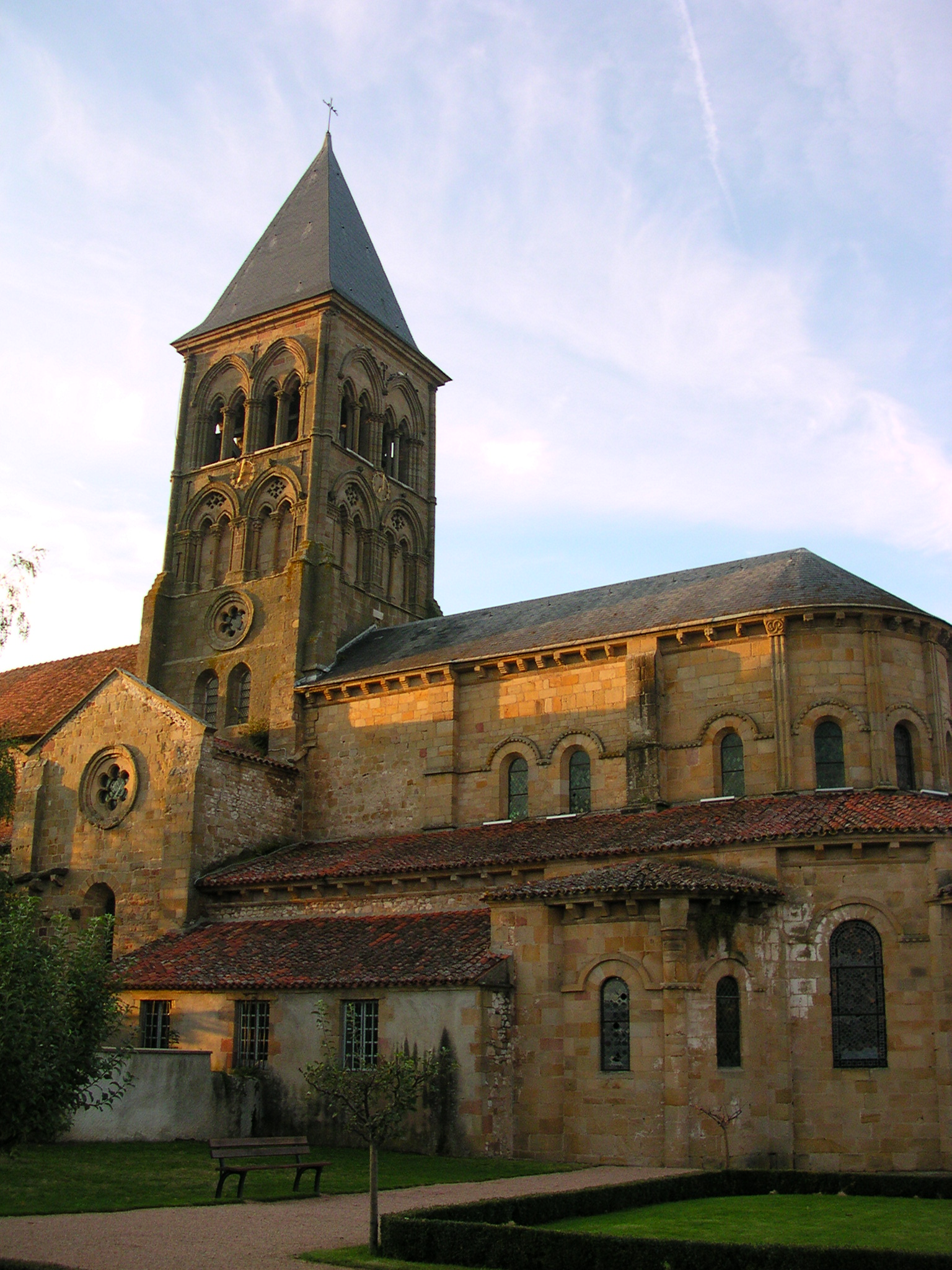 a large church with a tower near an orange house