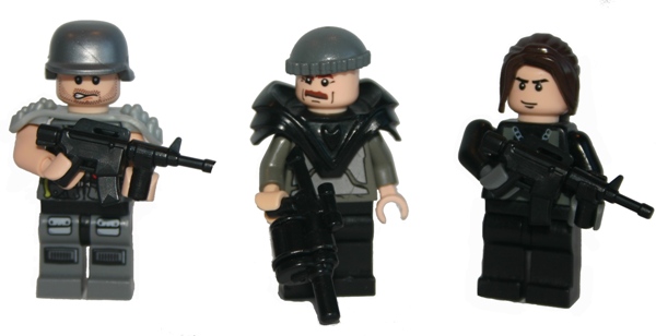 the toy figures are of a group of people holding guns