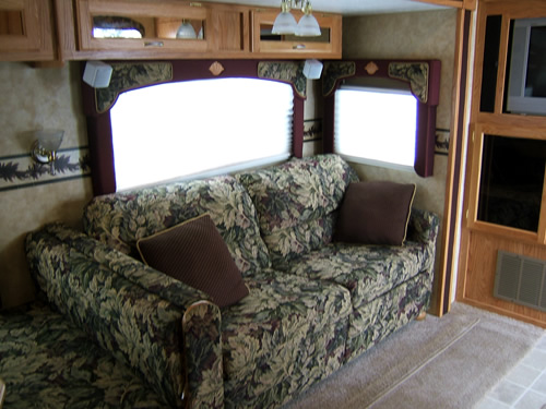 a couch sits in front of an rv door