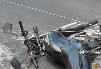 a motorcycle is being worked on with tools