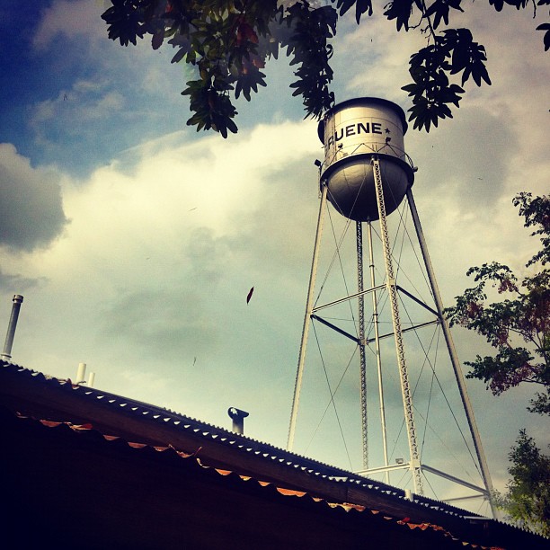 a water tower sitting on top of a roof