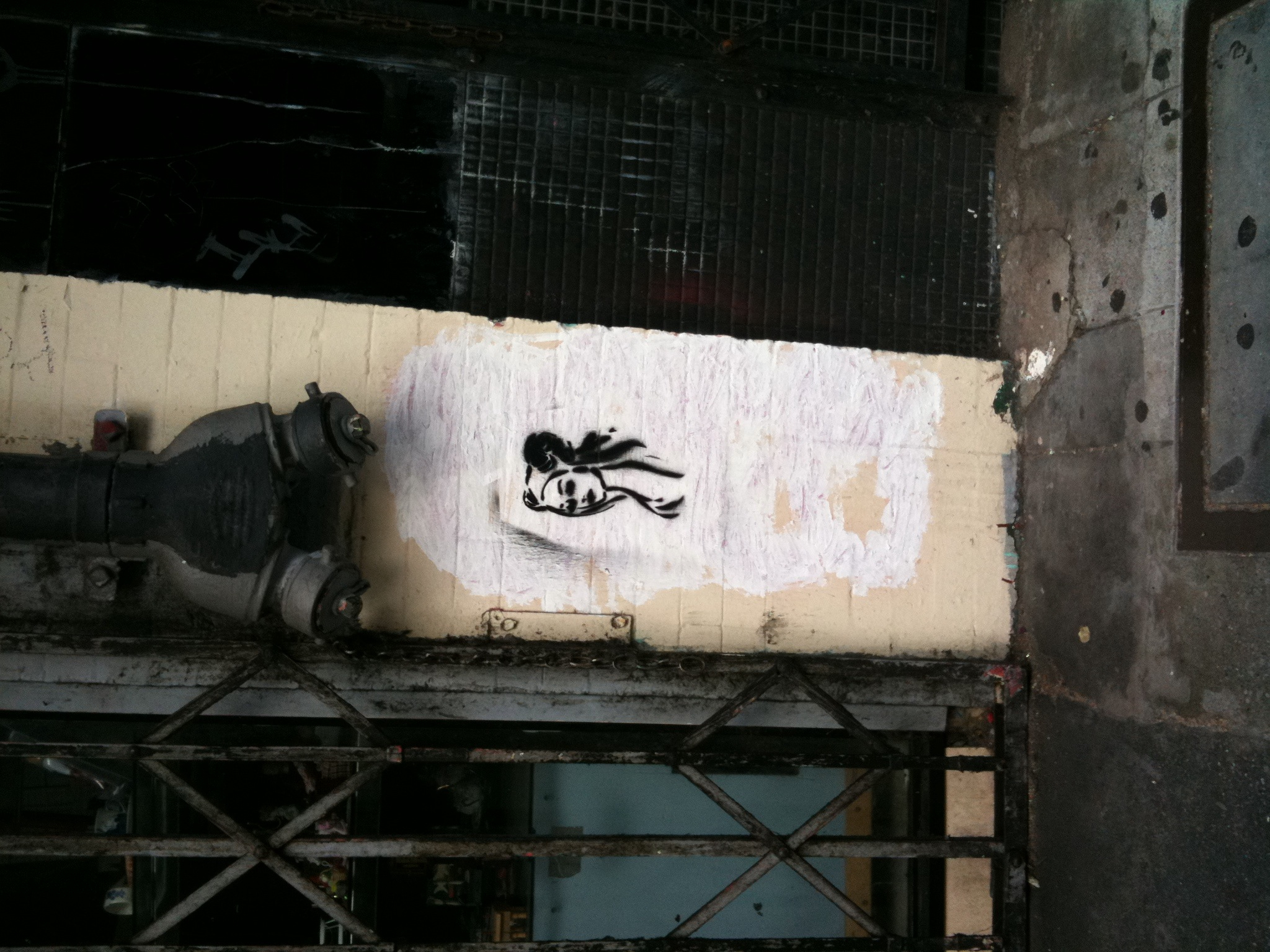 a graffitti artwork depicts a spider on the wall