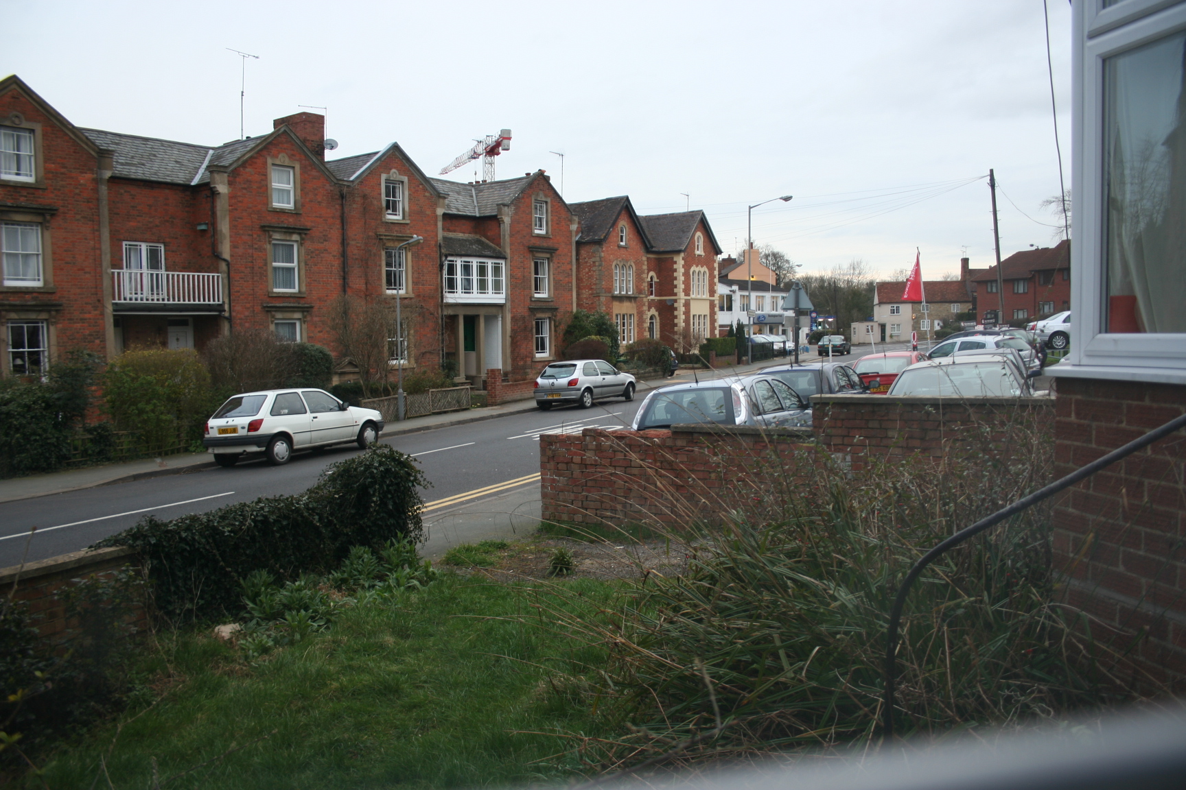 a group of cars parked on the side of a road