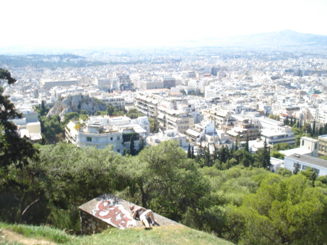 an aerial view of a city from a high hilltop