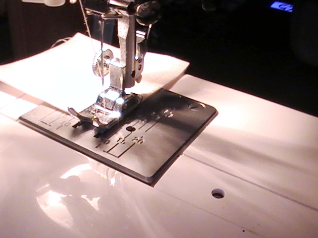 a sewing machine with the needle pointing out