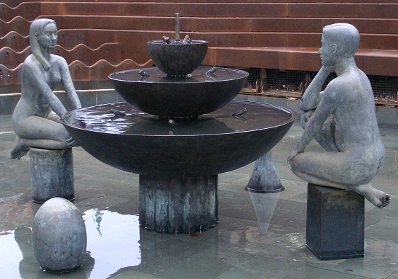 an image of statue fountains on a public square