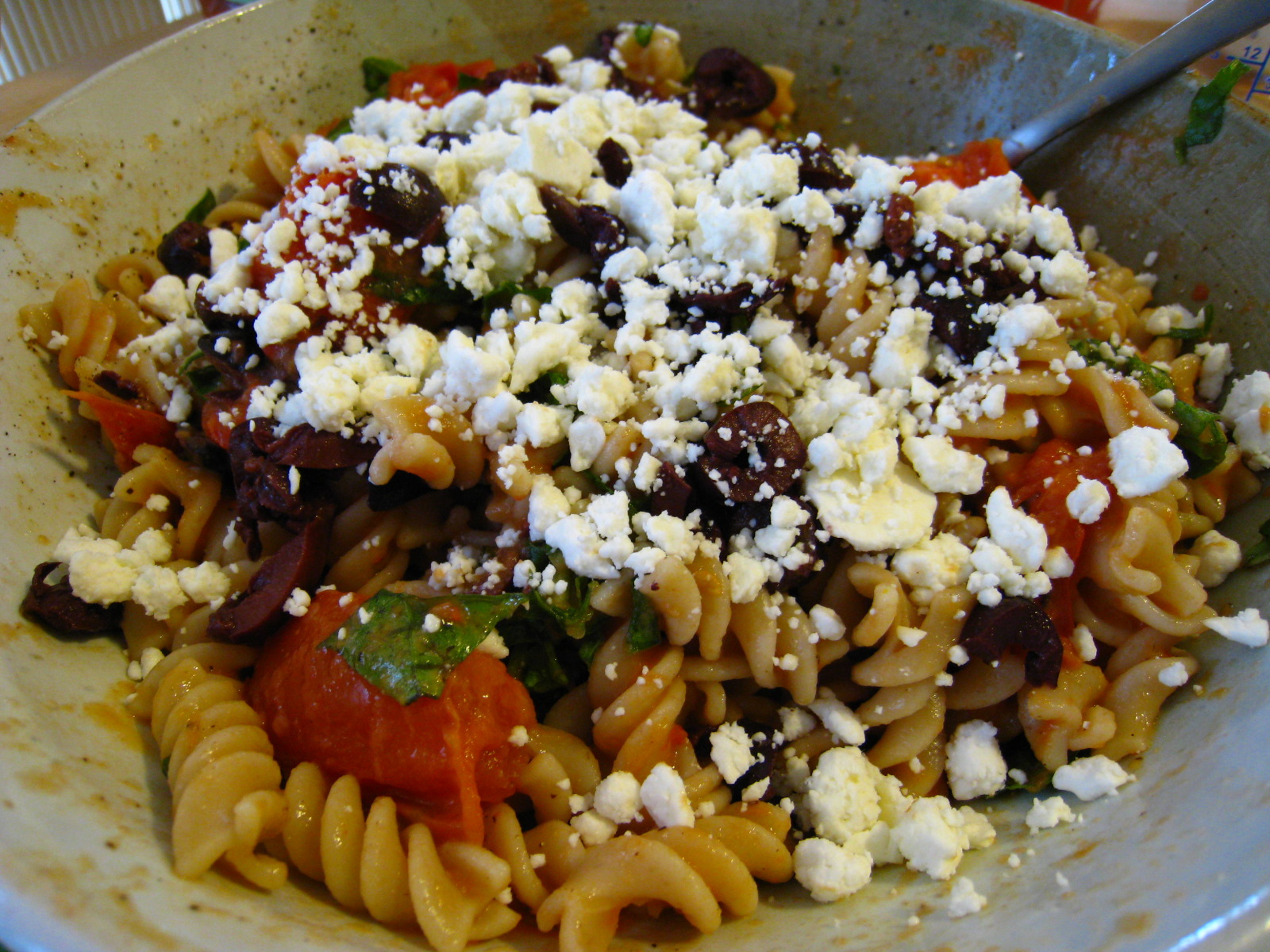 some very pretty pasta and vegetables with feta cheese