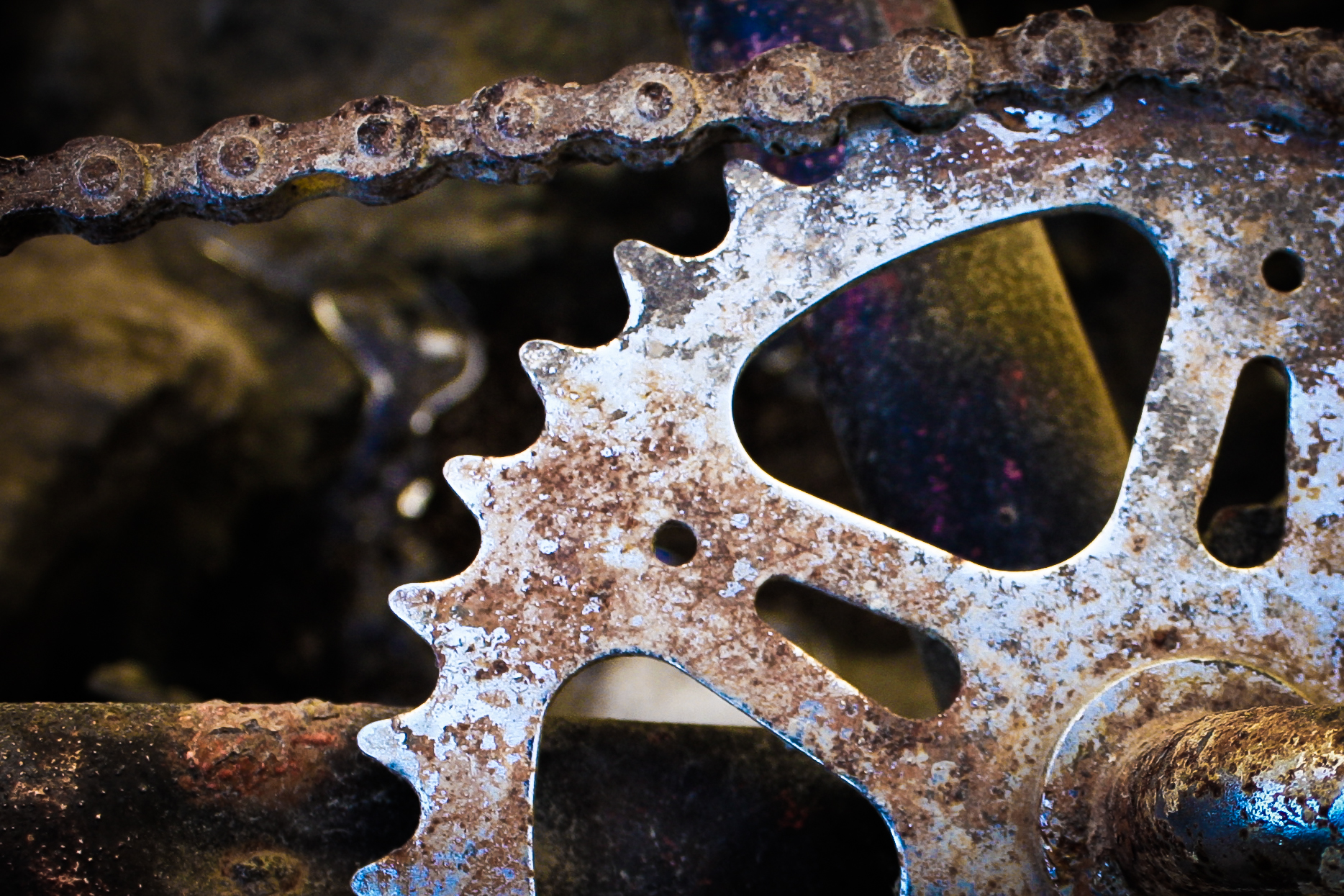 close up of an old bicycle gear, with rusted parts