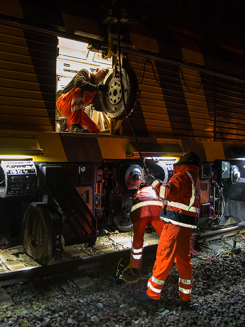 two men on a railroad platform with their gear