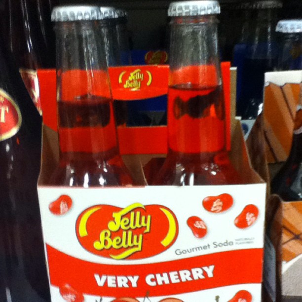 several packs of very berry soda on a table