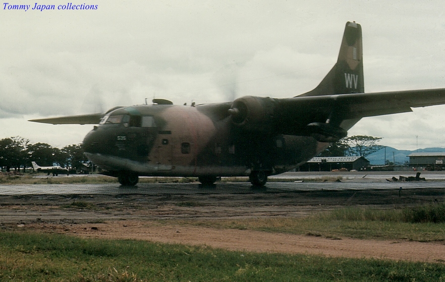 a vintage po of an airplane on the tarmac