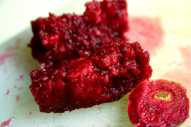 raspberries being peeled to become soing red