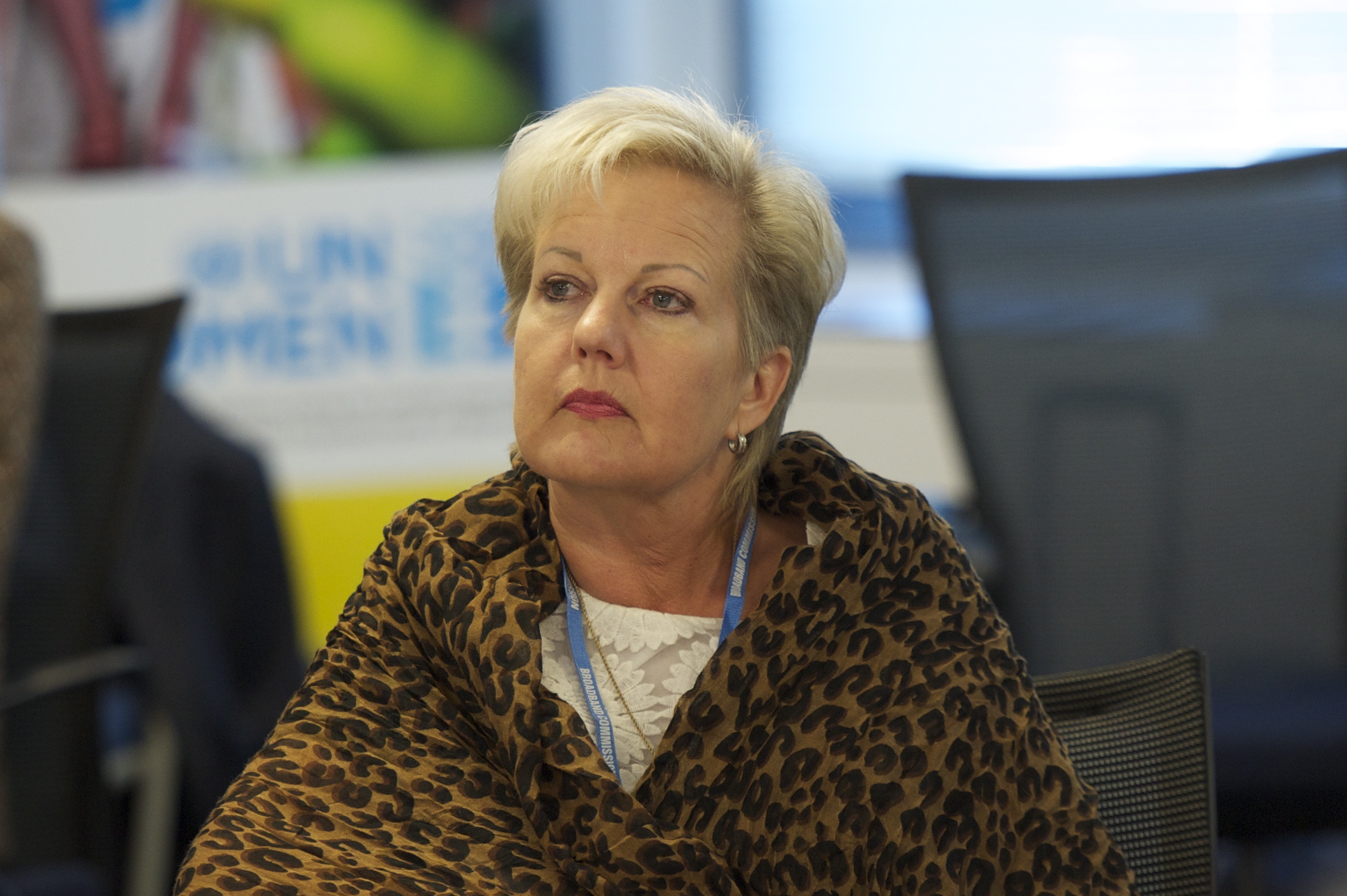 the woman is sitting at a desk waiting for her job