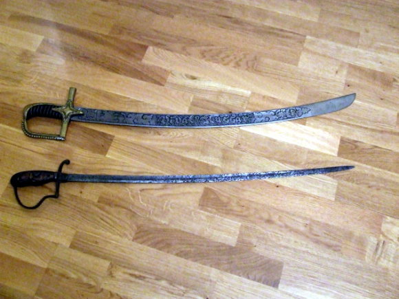 two old swords are on the floor