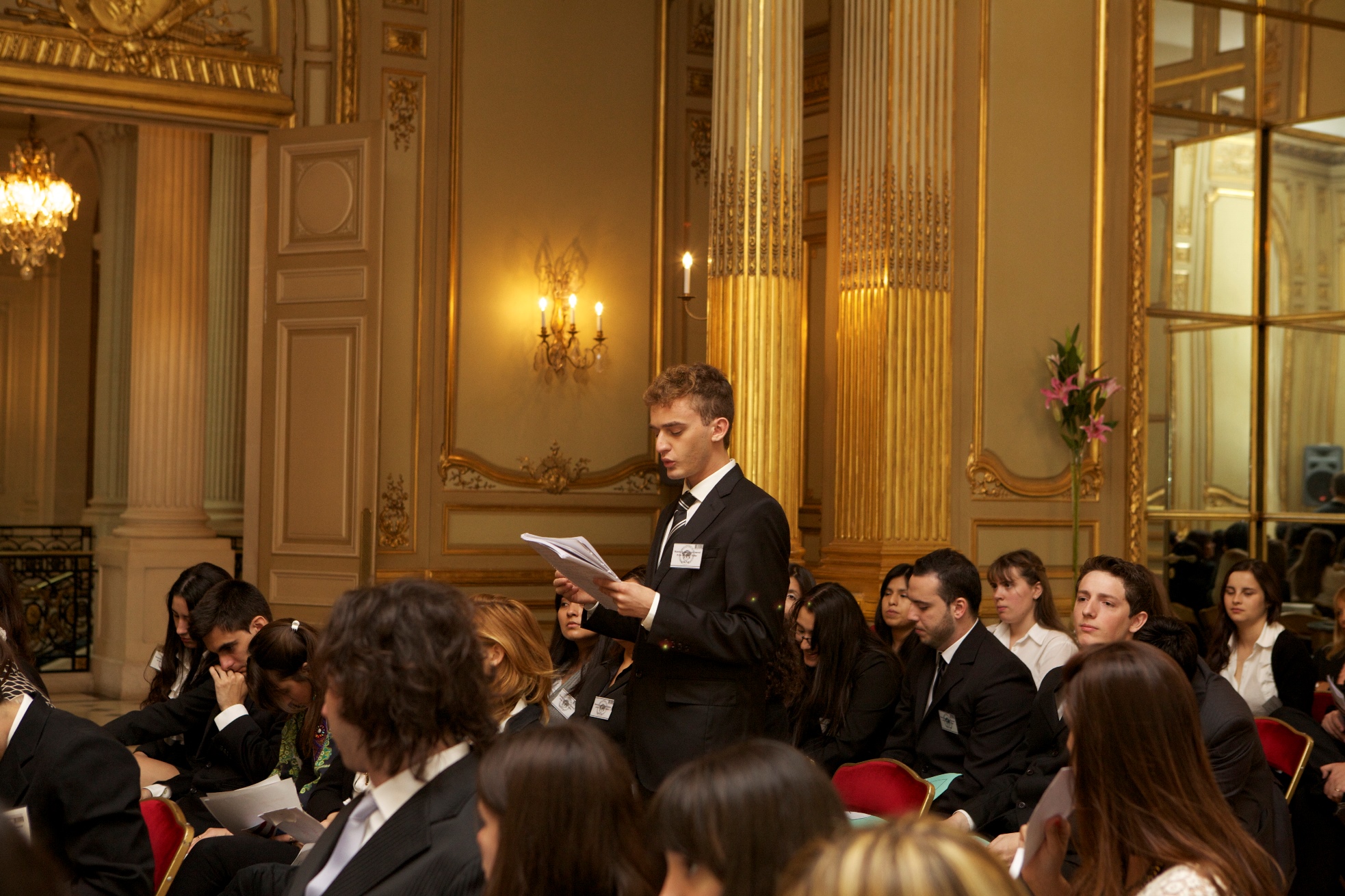 a man stands in front of a crowd